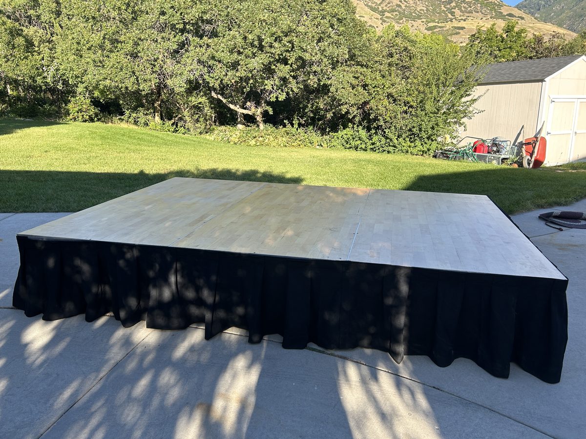 8 by 12 foot maple top stage built by Reeverb Entertainment